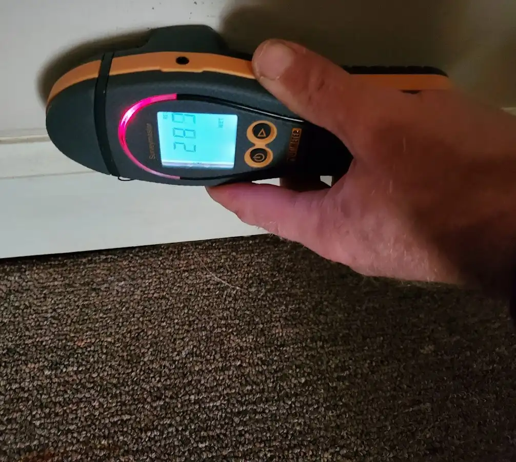 Moisture detection at baseboard during Storm Damage Restoration in Patterson